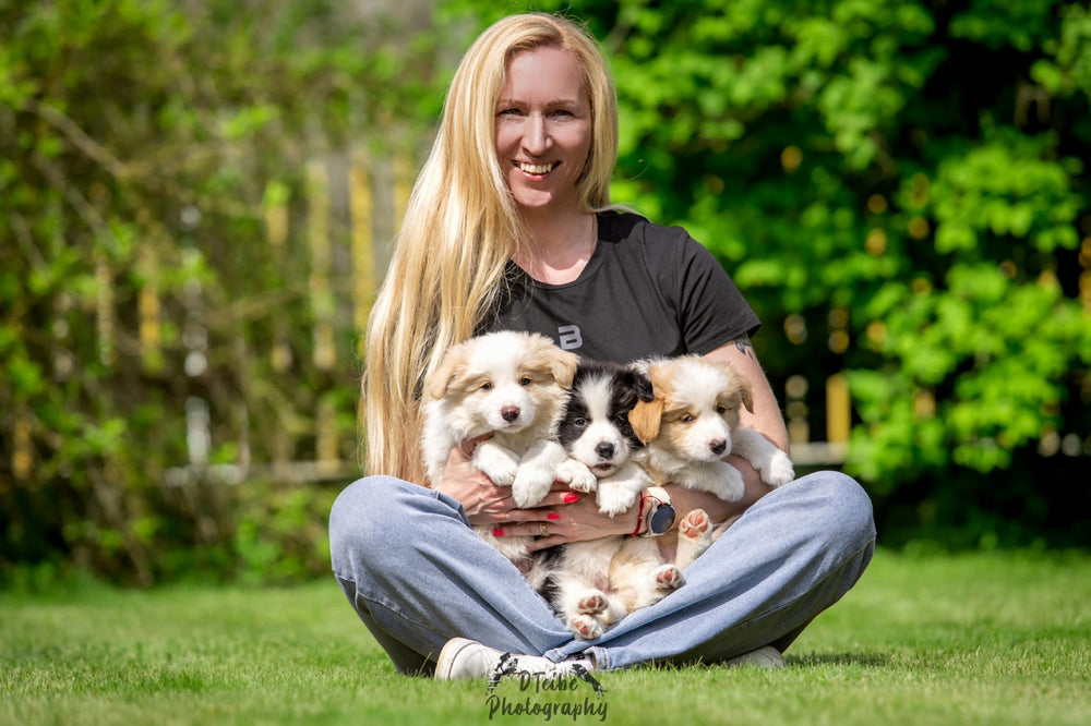 Annivia dibinātāja ar borderkollijs kuceni